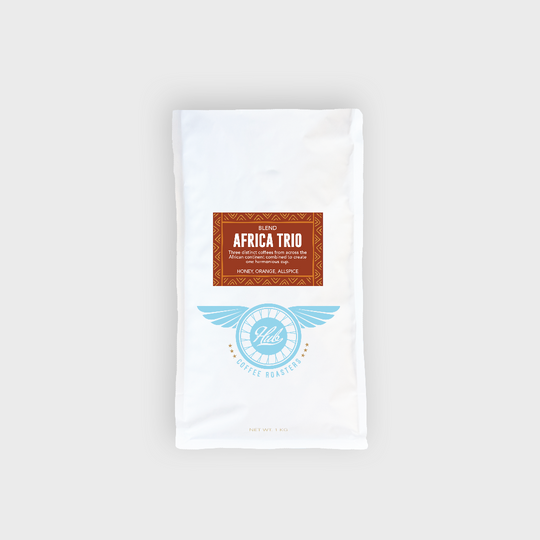 White coffee bag with 'Africa Trio' label on a white background